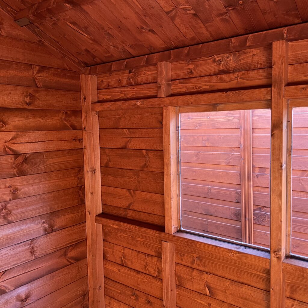 Interior of a Tiger XL Heavyweight Workshop showing a medium window and wooden walls