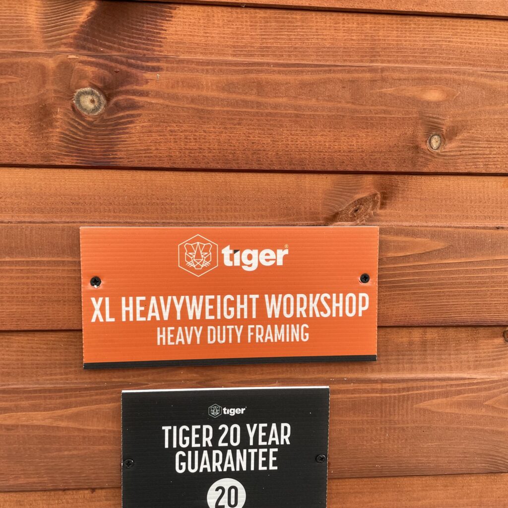 Signage for the Tiger XL Heavyweight Workshop with guarantee details