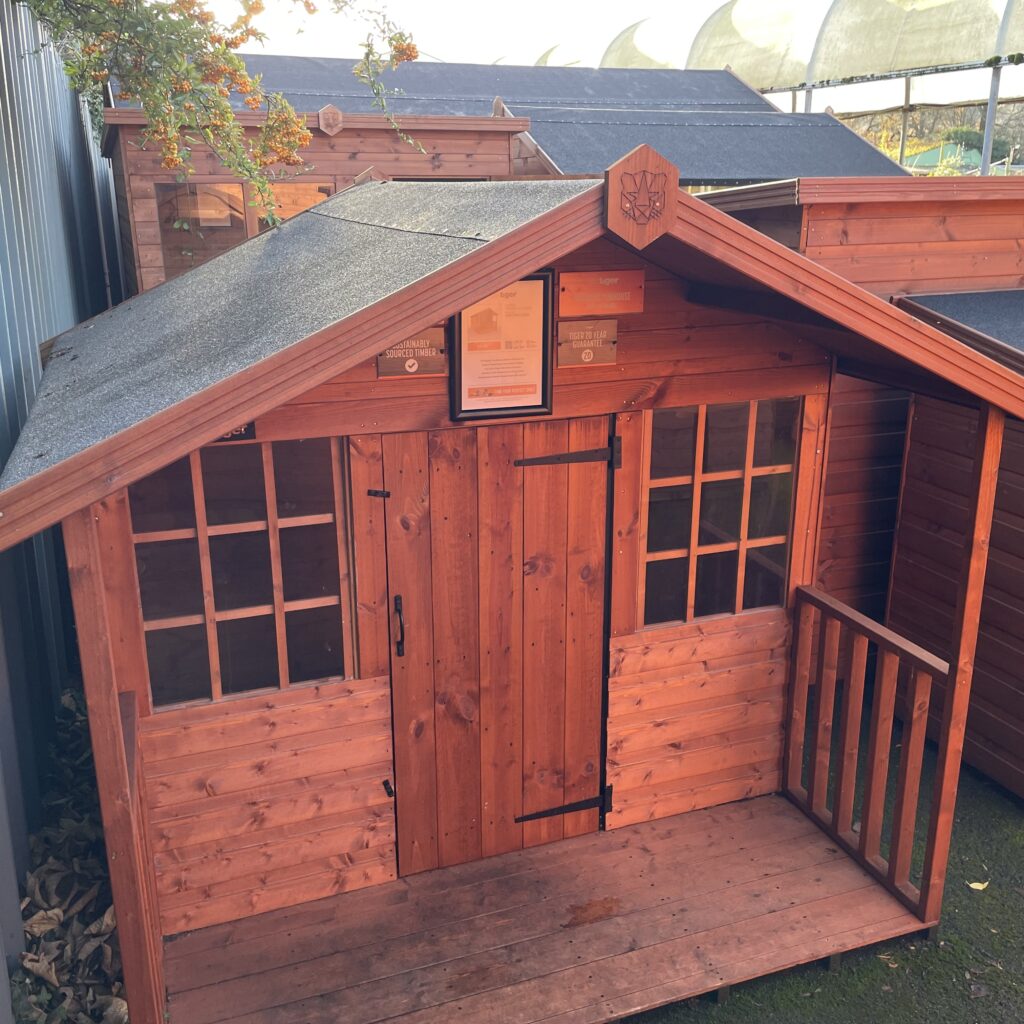 Tiger Funhouse playhouse with a porch and double windows