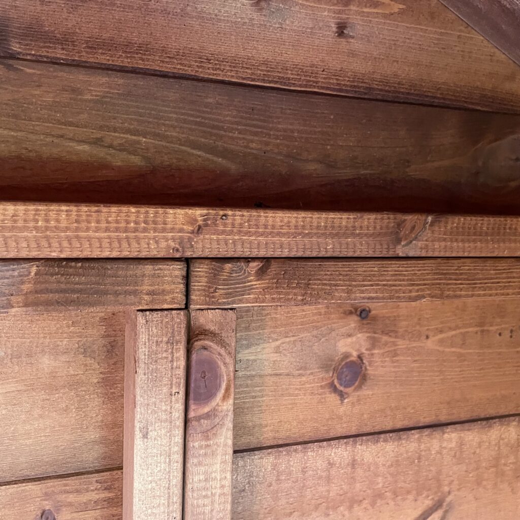 Close-up of the apex roof joinery on a TigerFlex bike shed