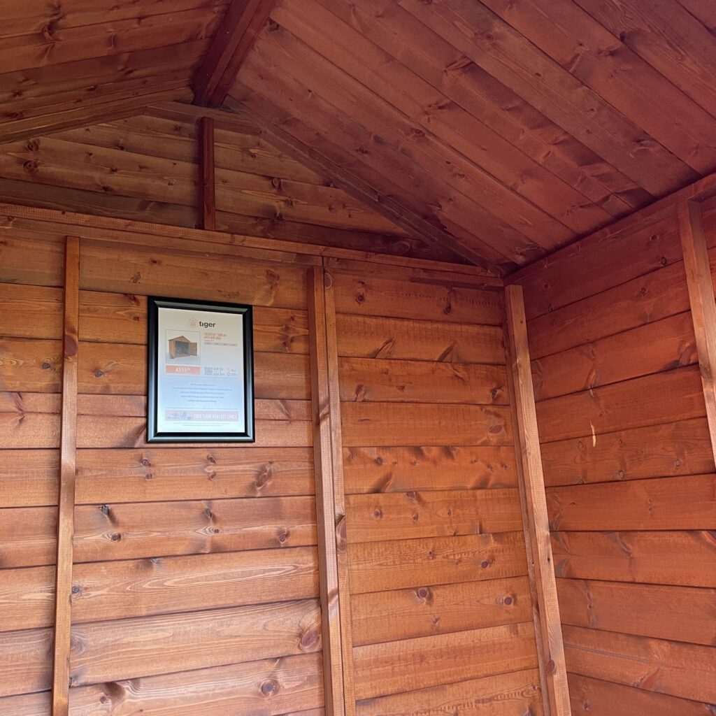 Interior view of the TigerFlex Apex Bike Shed with wooden walls