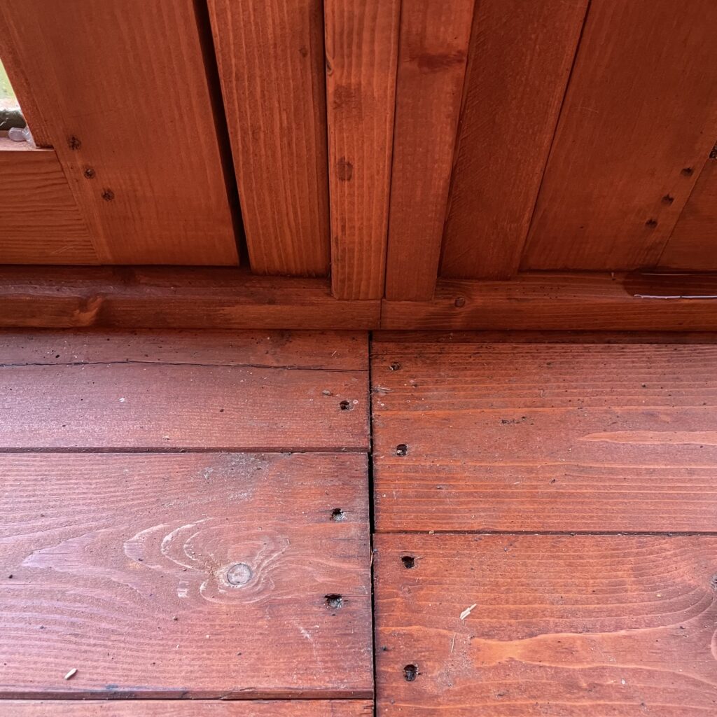Close-up of the floor joinery in the TigerFlex Shiplap Pent Full Pane Summerhouse
