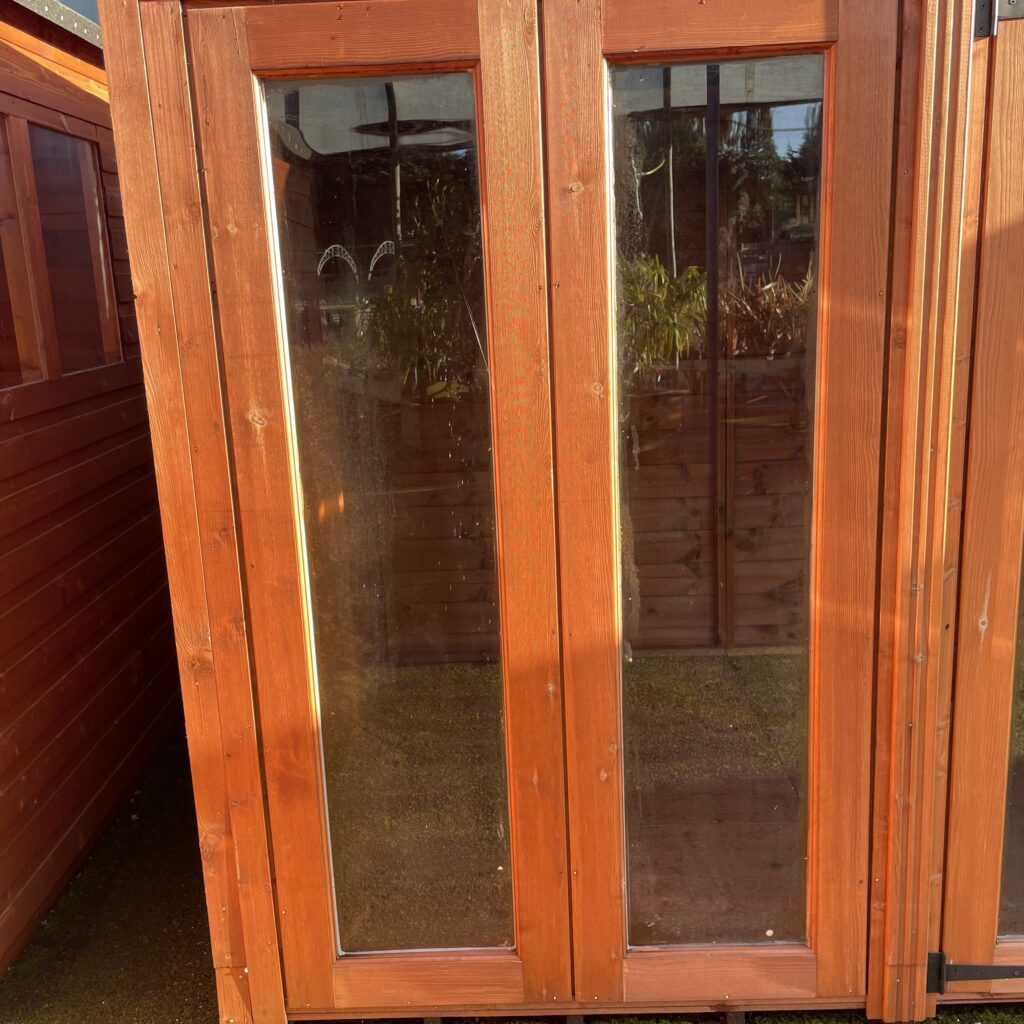 Full-pane doors of the TigerFlex Shiplap Pent Summerhouse showcasing wooden framing