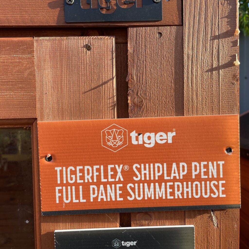 TigerFlex Shiplap Pent Full Pane Summerhouse sign at show site