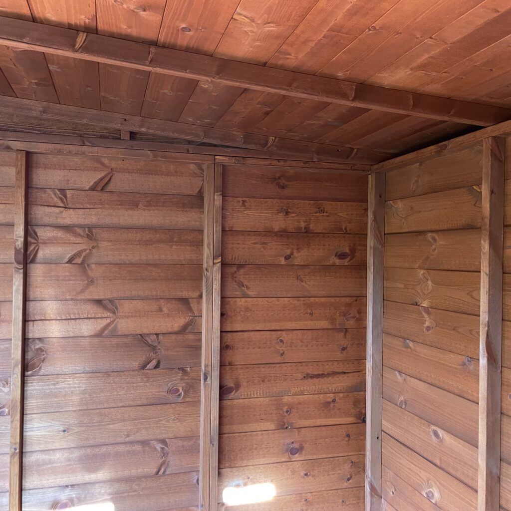Interior view of a TigerFlex Shiplap Pent Summerhouse showcasing shiplap walls