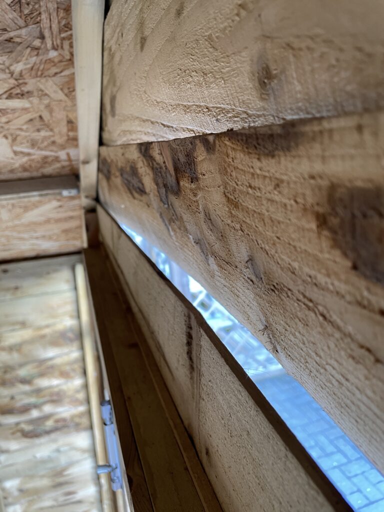 Cheaper alternative showing the thinner Overlap Cladding. This image shows have low quality wood mixed with a low quality construction method warp and pull away. This will create both a security risk and drafts.